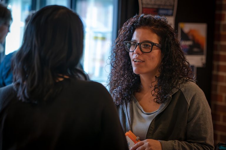 Psychological safety at work: a workshop participant speaking while a colleague listens